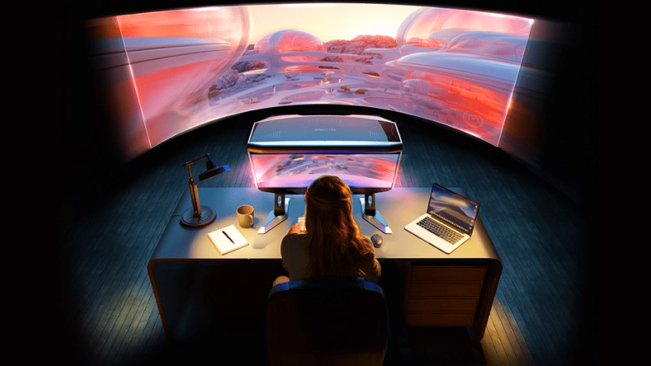 Person seated at a desk with a curved panoramic screen showing a pink sunset scene, laptop nearby, notebook and mug on the desk, glowing workspace.