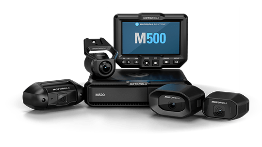 Motorola M500 video conferencing system with a central display showing 'M500', a base unit, and four compact cameras around it.