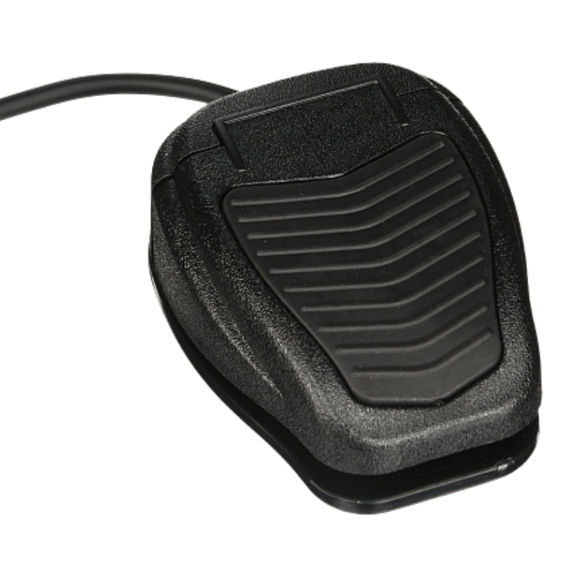Black foot pedal with a ribbed rubber surface and attached cord, used as a hands-free control for a device